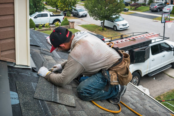 Professional Roofing technician working in Camp Sherman, OR